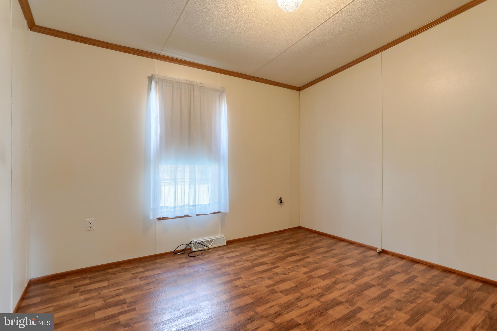 22 Elizabeth Avenue Lebanon, PA 17042 - Photo 22 of 28 a view of empty room with wooden floor and fan