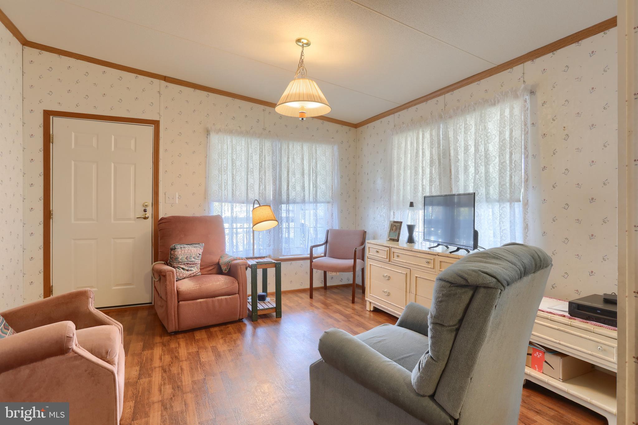 22 Elizabeth Avenue Lebanon, PA 17042 - Photo 6 of 28 a living room with furniture fireplace and a large window