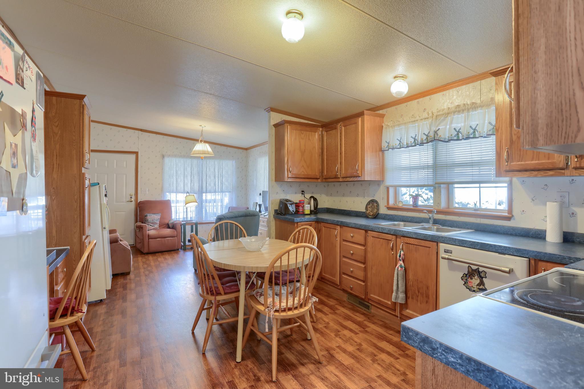 22 Elizabeth Avenue Lebanon, PA 17042 - Photo 10 of 28 a kitchen with stainless steel appliances granite countertop wooden cabinets a dining table and chairs