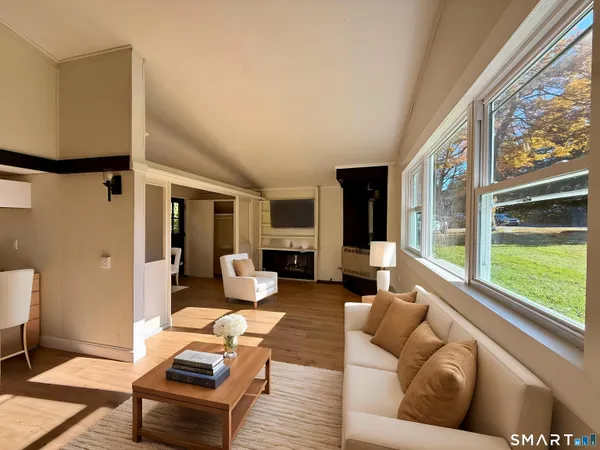 a living room with furniture and a large window