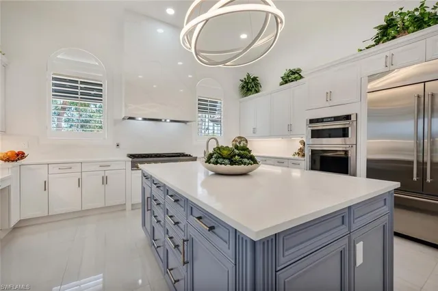 a kitchen with a white cabinets and white appliances