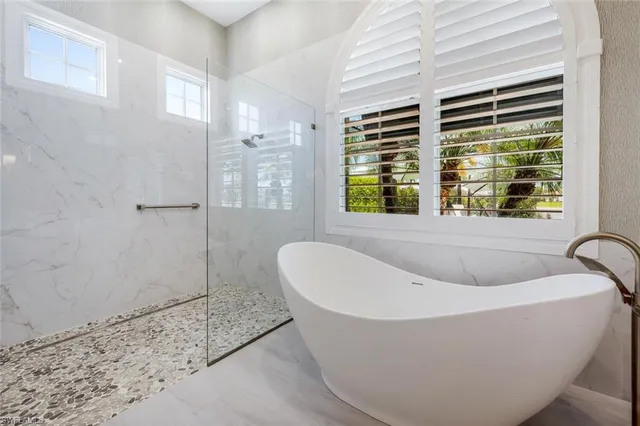a bathroom with a granite countertop sink mirror and vanity
