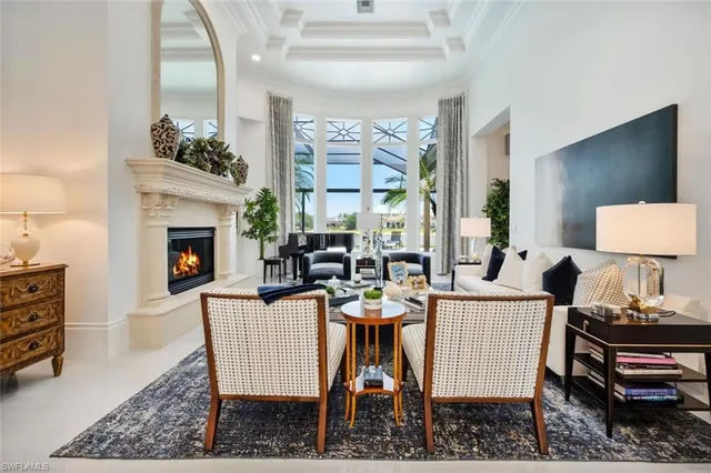 a dining room with furniture a fireplace and wooden floor