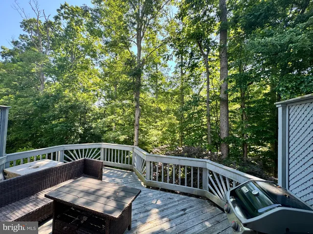 a view of balcony with furniture and trees