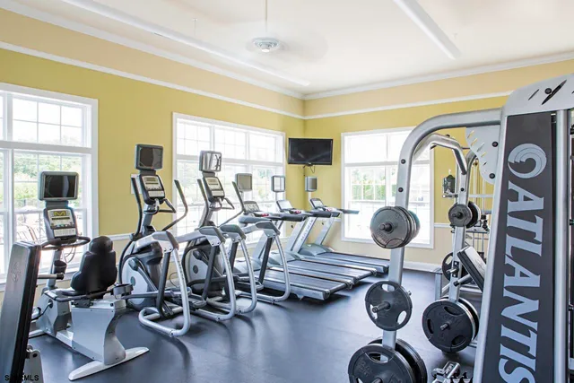 a view of a livingroom with furniture and a window