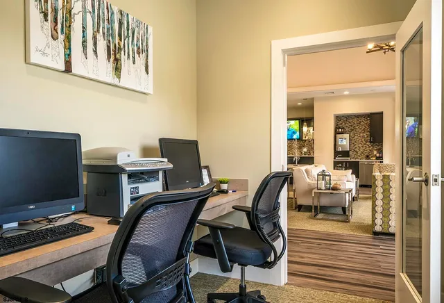a view of swimming pool with lawn chairs and plants