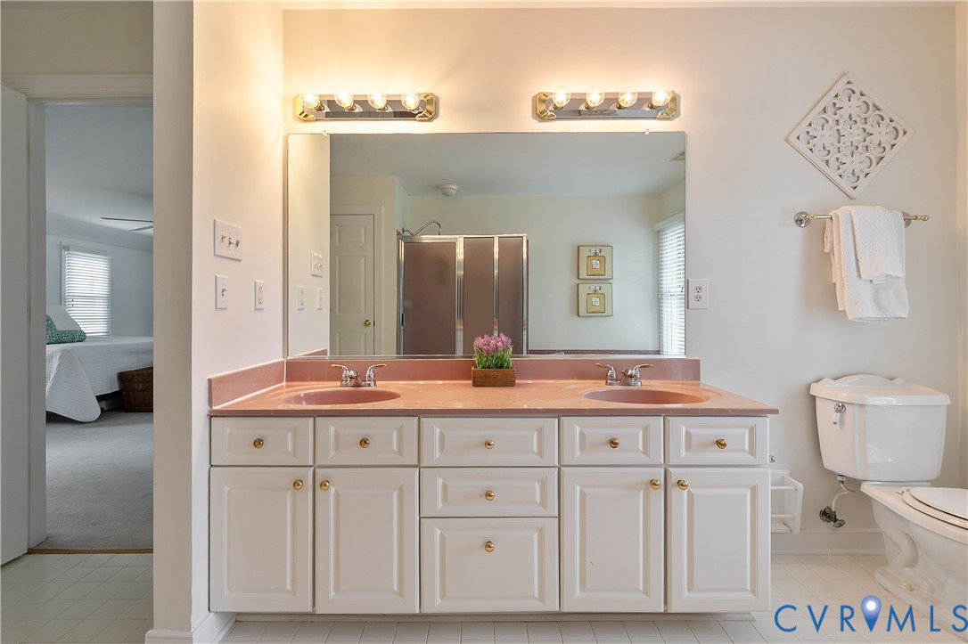 2130 Manakin Road Manakin-Sabot, VA 23103 - Photo 34 of 65 a spacious bathroom with a double vanity sink and a mirror