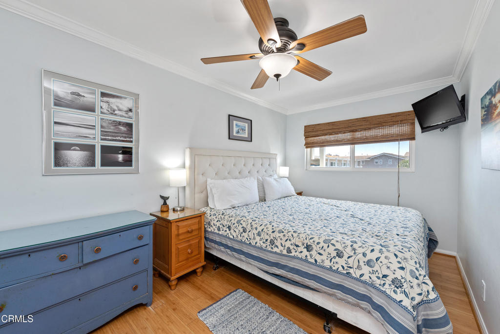 4975 Sandyland Road, Unit 302 Carpinteria, CA 93013 - Photo 13 of 28 a bedroom with a large bed and a window