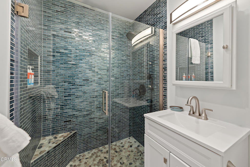 4975 Sandyland Road, Unit 302 Carpinteria, CA 93013 - Photo 15 of 28 a bathroom with a sink a toilet and shower