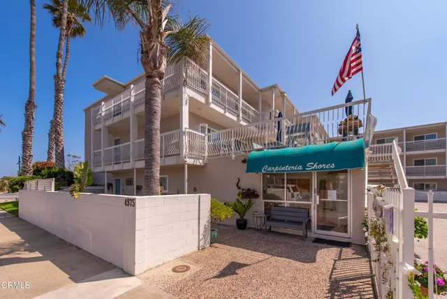 a view of a building with sitting area