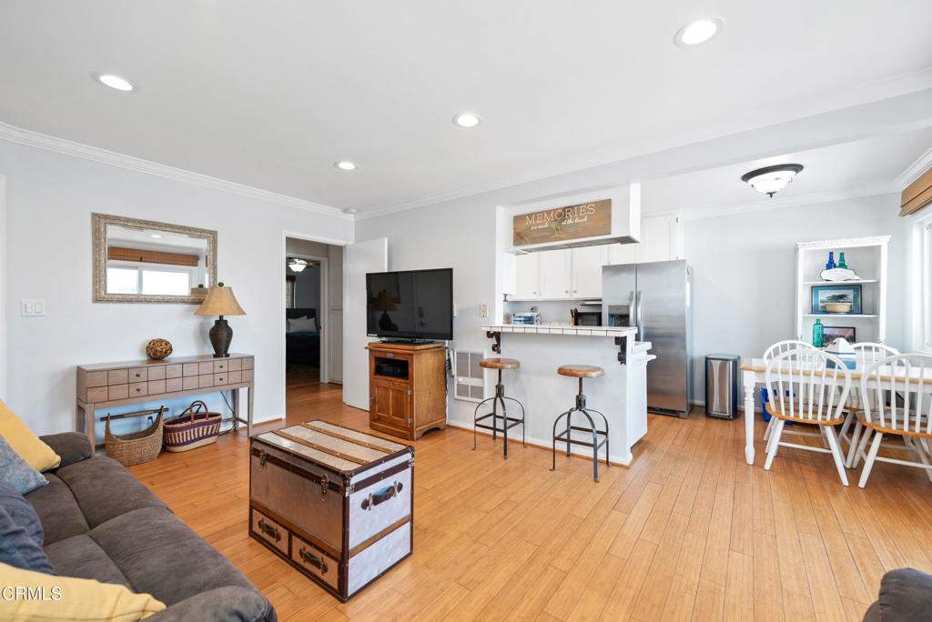4975 Sandyland Road, Unit 302 Carpinteria, CA 93013 - Photo 6 of 28 a living room with furniture and a flat screen tv