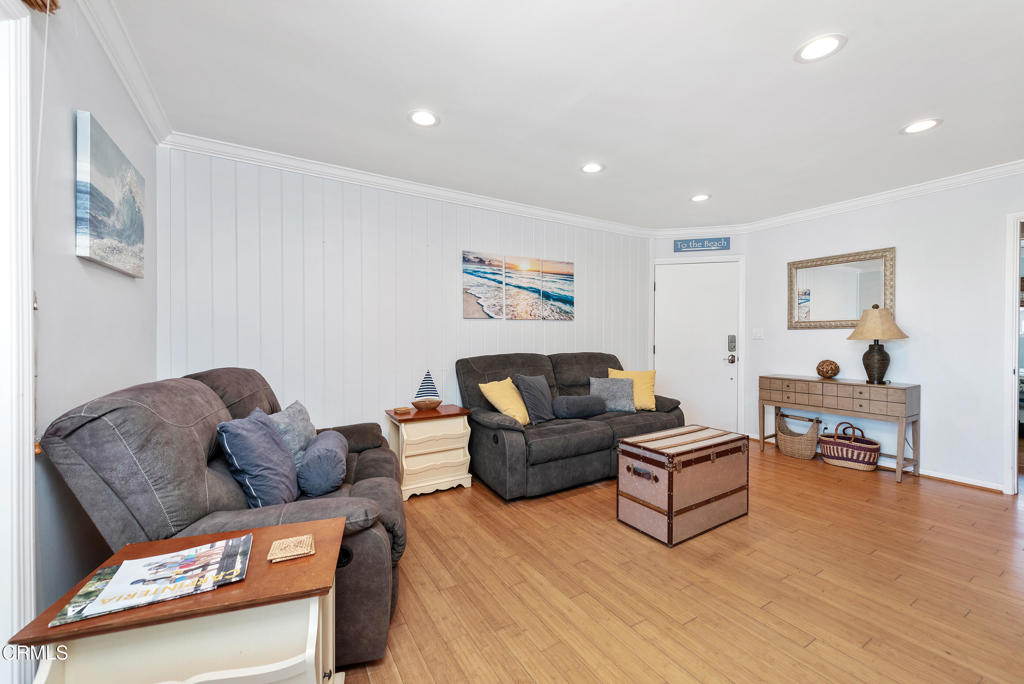 4975 Sandyland Road, Unit 302 Carpinteria, CA 93013 - Photo 8 of 28 a living room with furniture and a wooden floor