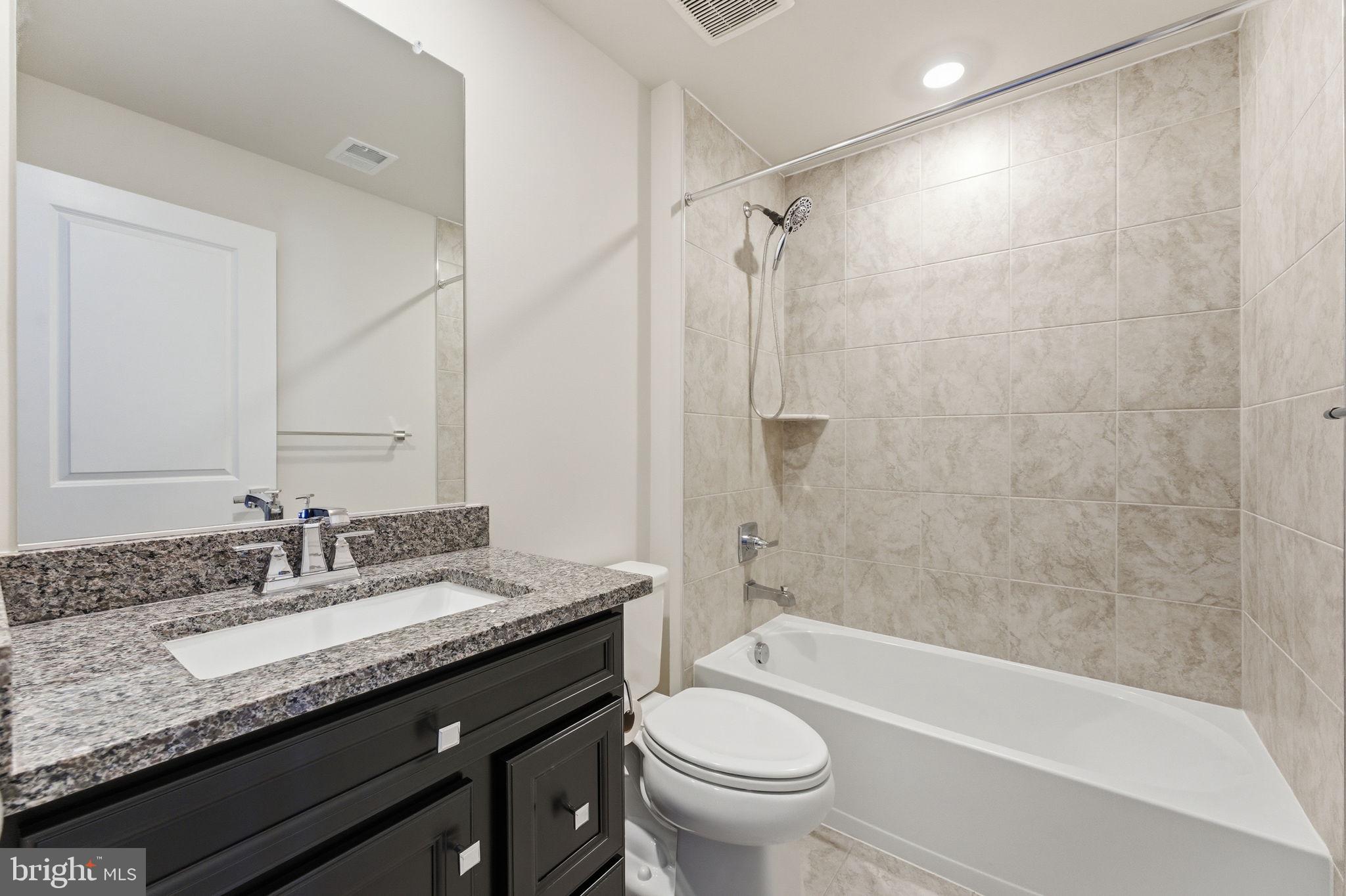 3754 Mayors Way Fairfax, VA 22030 - Photo 11 of 57 a bathroom with a granite countertop sink toilet and shower