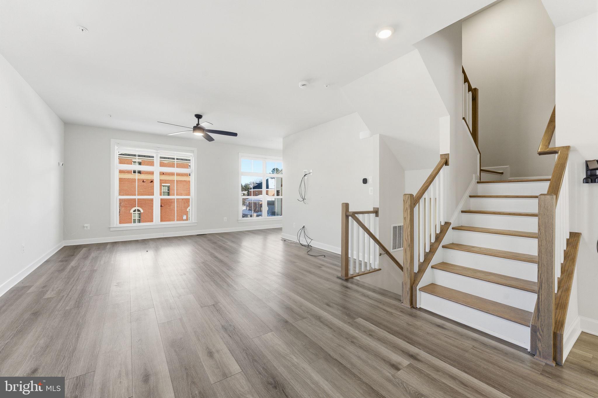 3754 Mayors Way Fairfax, VA 22030 - Photo 12 of 57 a view of an empty room with wooden floor and a window
