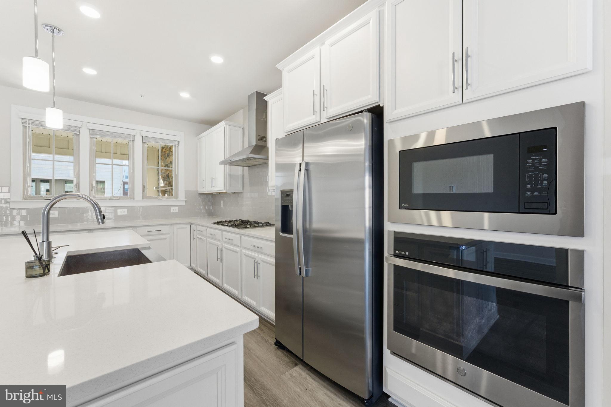 3754 Mayors Way Fairfax, VA 22030 - Photo 18 of 57 a kitchen with a refrigerator sink and cabinets