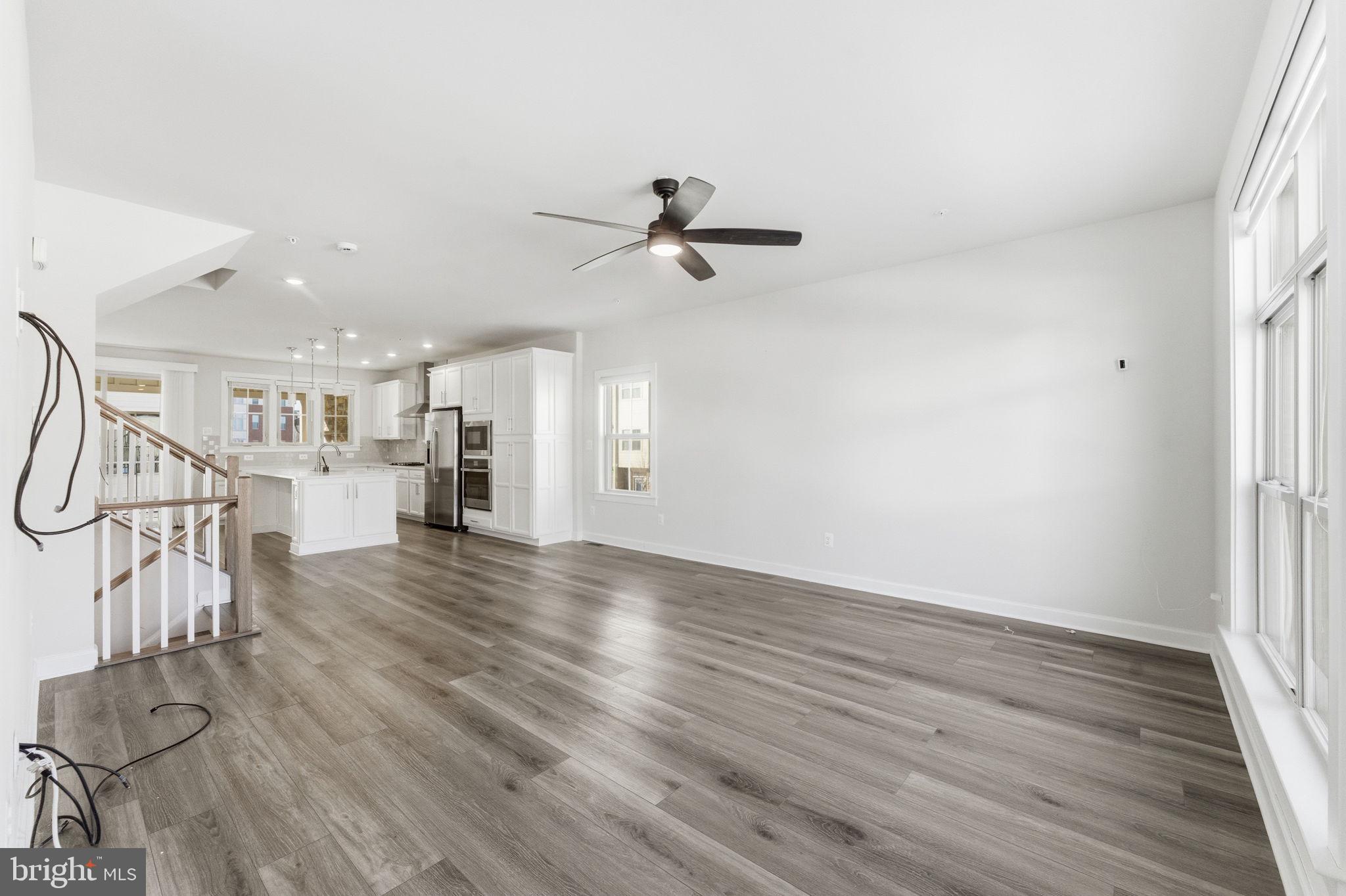 3754 Mayors Way Fairfax, VA 22030 - Photo 24 of 57 a view of a room with wooden floor and ceiling fan