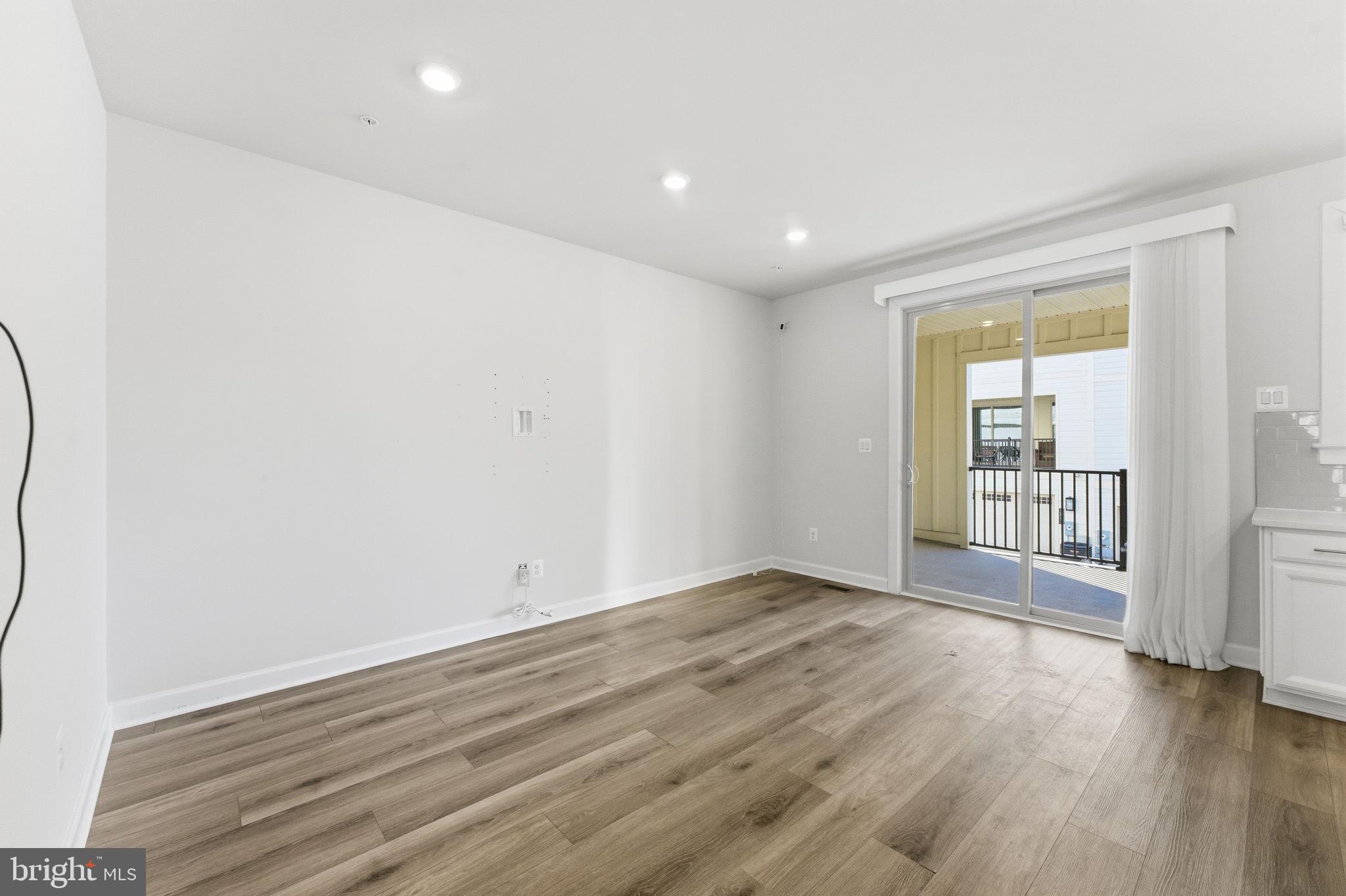 3754 Mayors Way Fairfax, VA 22030 - Photo 25 of 57 an empty room with wooden floor and windows