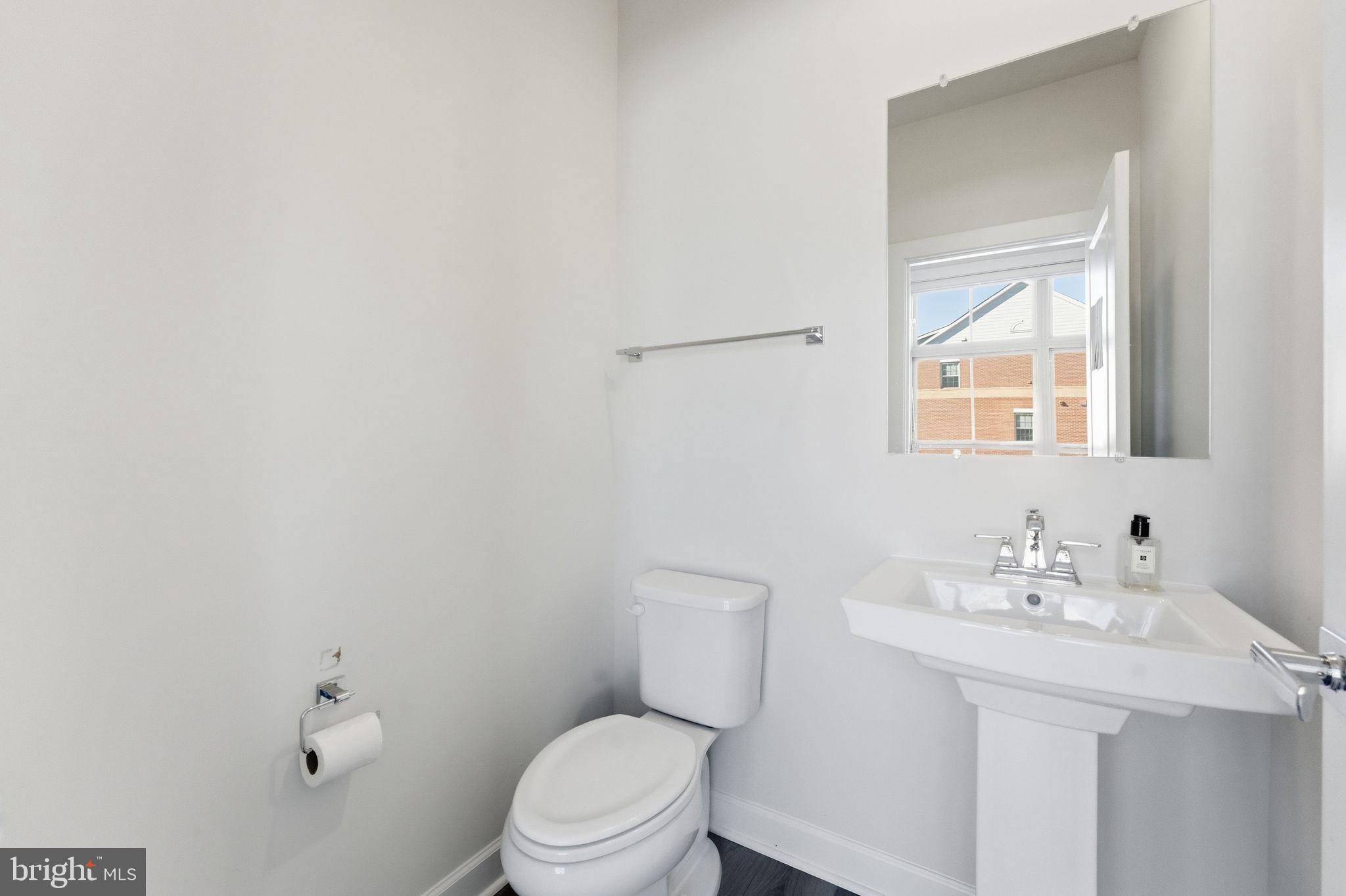 3754 Mayors Way Fairfax, VA 22030 - Photo 26 of 57 a bathroom with a toilet a sink and mirror