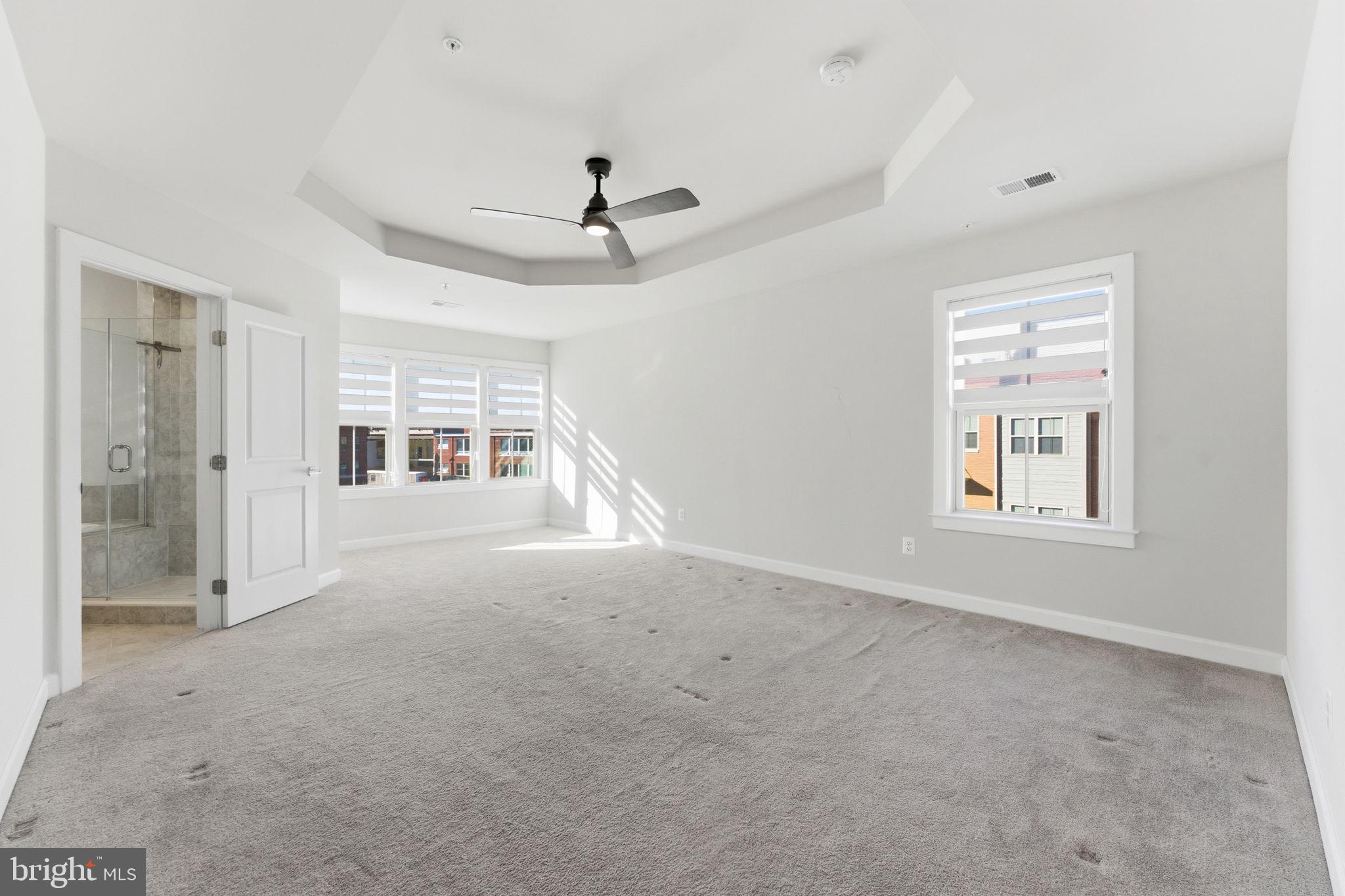 3754 Mayors Way Fairfax, VA 22030 - Photo 31 of 57 an empty room with windows and ceiling fan