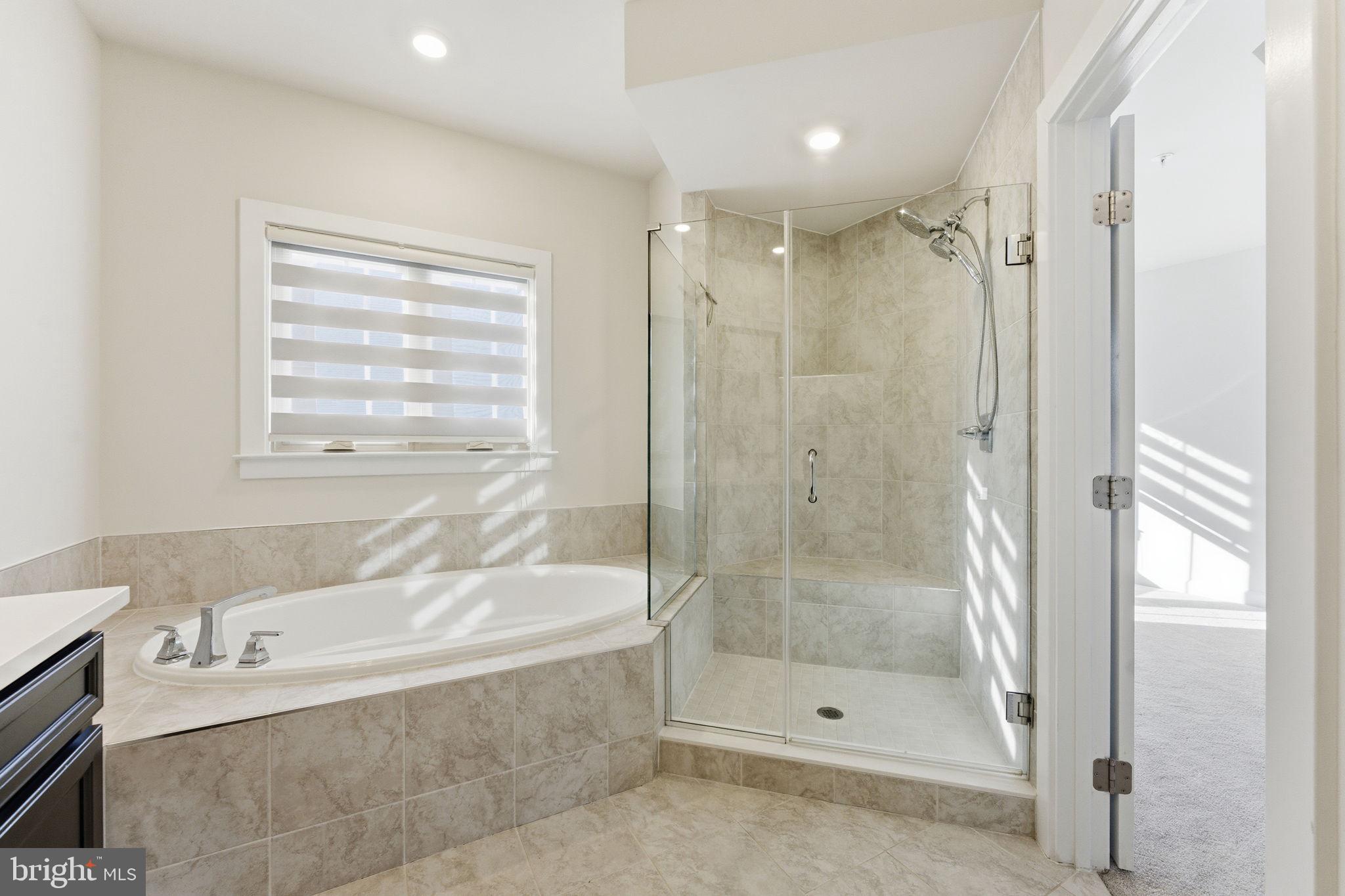 3754 Mayors Way Fairfax, VA 22030 - Photo 37 of 57 a bathroom with a shower and a bathtub