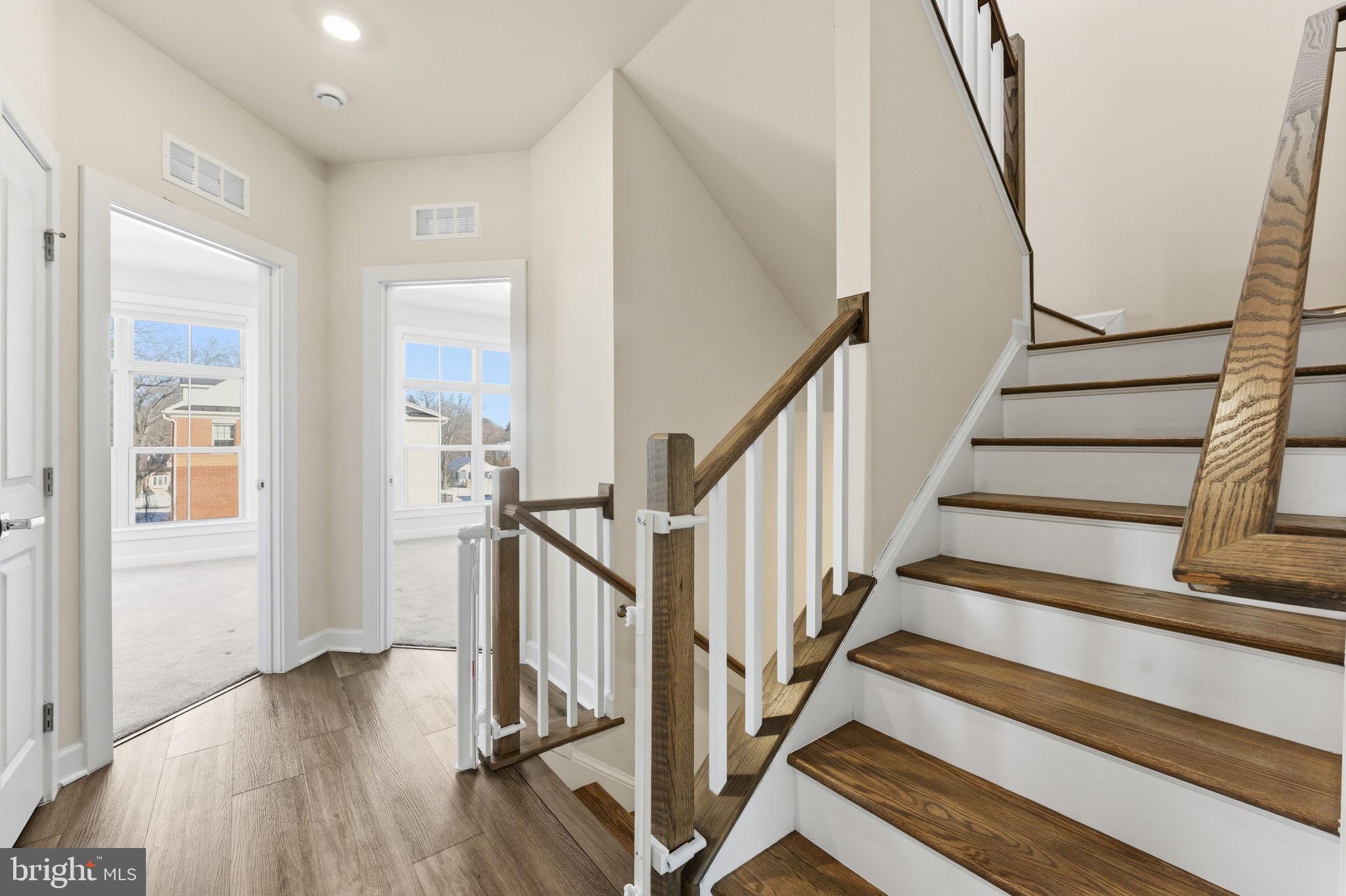 3754 Mayors Way Fairfax, VA 22030 - Photo 44 of 57 a view of front door with wooden floor and stairs
