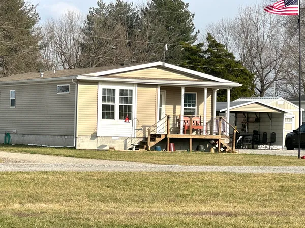 a front view of a house with a patio