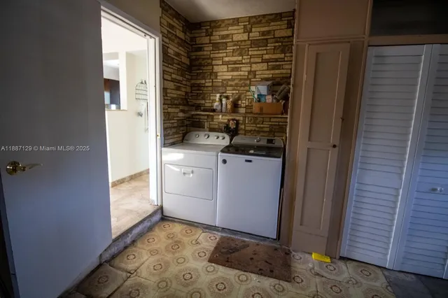a bathroom with a shower and a sink