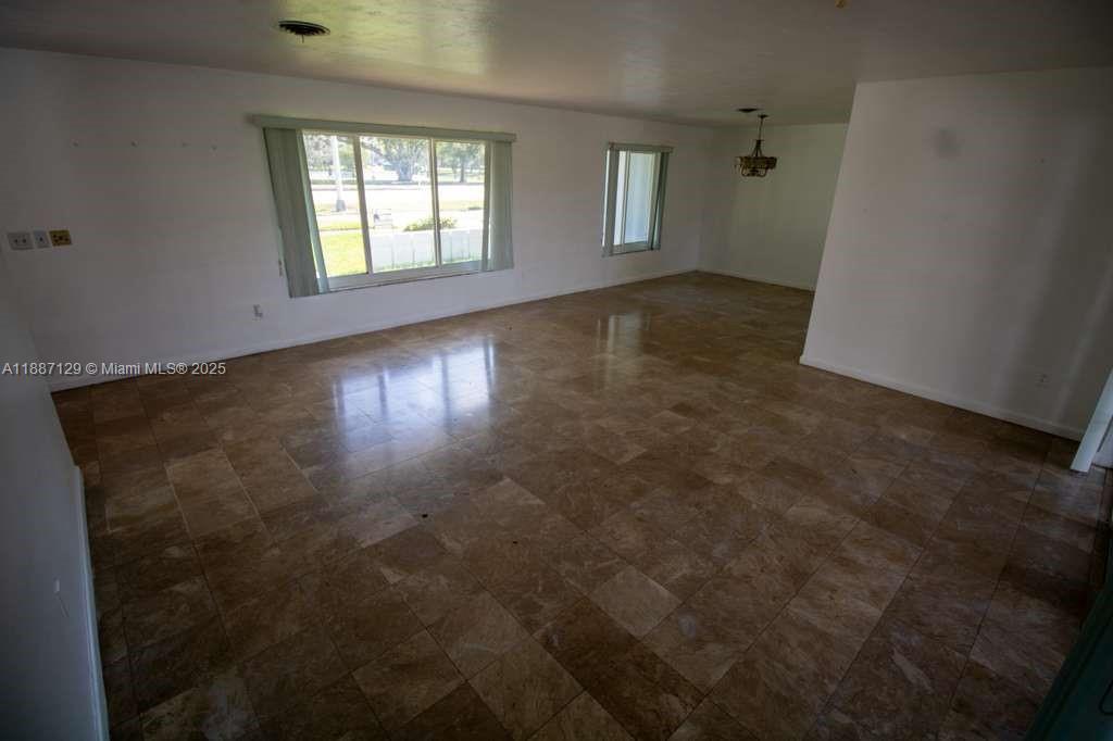 9041 Southwest 88th Street, Unit 9041 Miami, FL 33173 - Photo 20 of 34 an empty room with windows