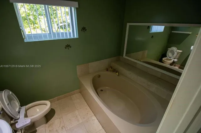a bathroom with a sink and toilet