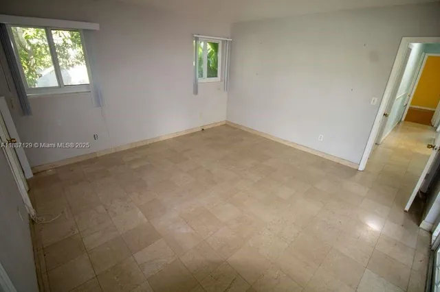 an empty room with windows