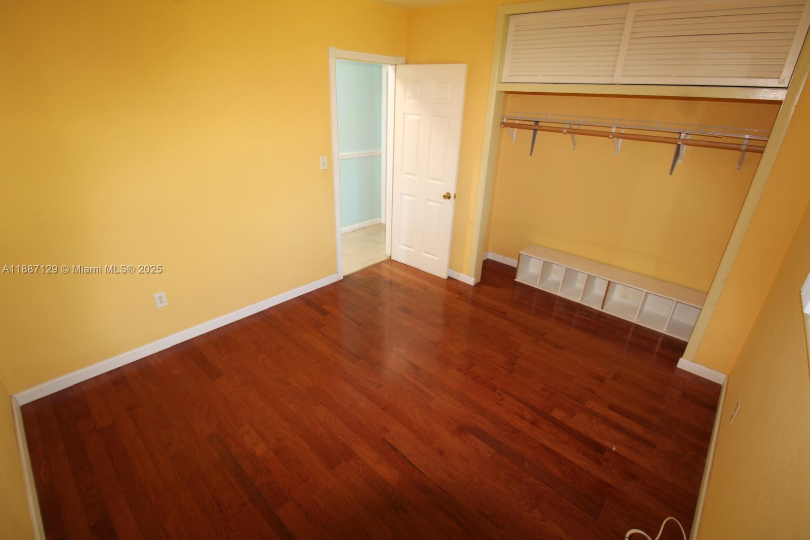 9041 Southwest 88th Street, Unit 9041 Miami, FL 33173 - Photo 34 of 34 a view of empty room with wooden floor