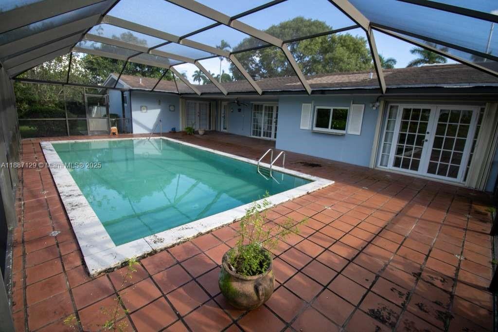 9041 Southwest 88th Street, Unit 9041 Miami, FL 33173 - Photo 7 of 34 a view of a backyard with a patio