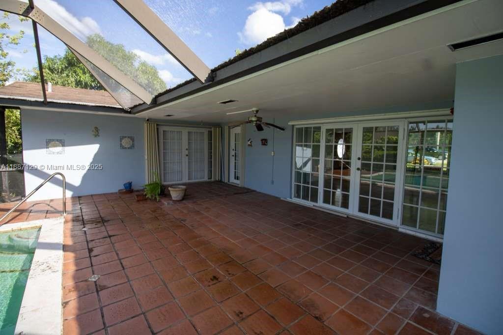 9041 Southwest 88th Street, Unit 9041 Miami, FL 33173 - Photo 9 of 34 a view of a porch with seating space