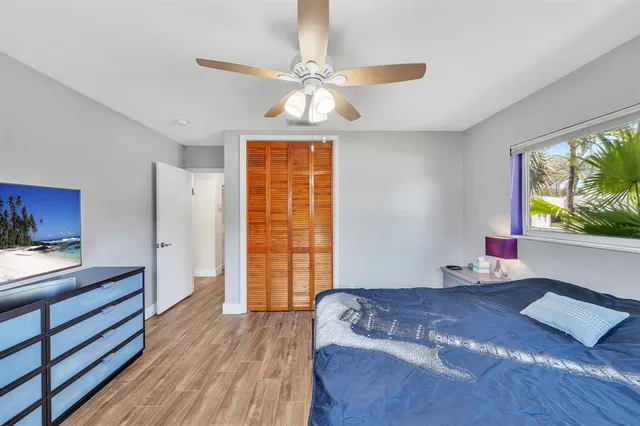 a large kitchen with granite countertop a stove top oven a sink a dining table and chairs