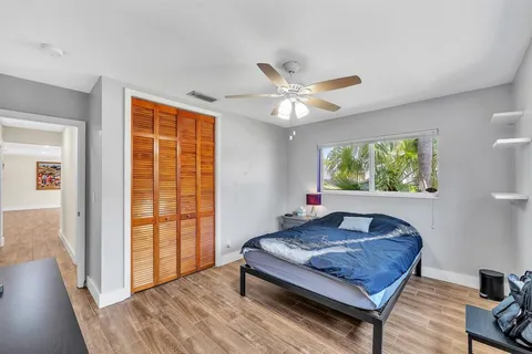 a large living room with stainless steel appliances granite countertop furniture and wooden floor