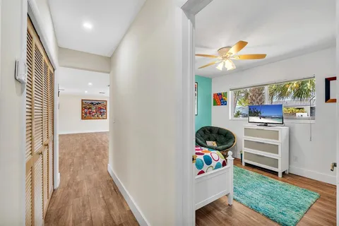 a kitchen with stainless steel appliances wooden cabinets a stove a microwave and a refrigerator