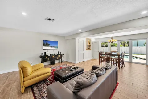 a view of living room filled with furniture and toys