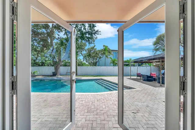 a patio with a patio table and chairs