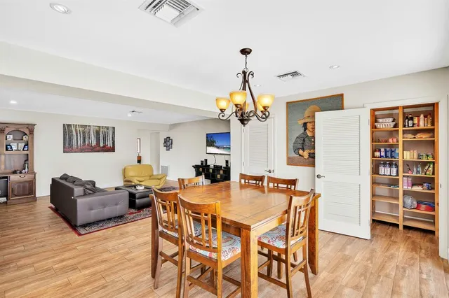 a view of backyard with swimming pool and seating space