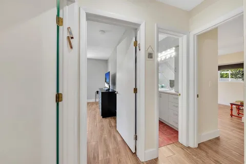 a view of a livingroom with furniture wooden floor and window