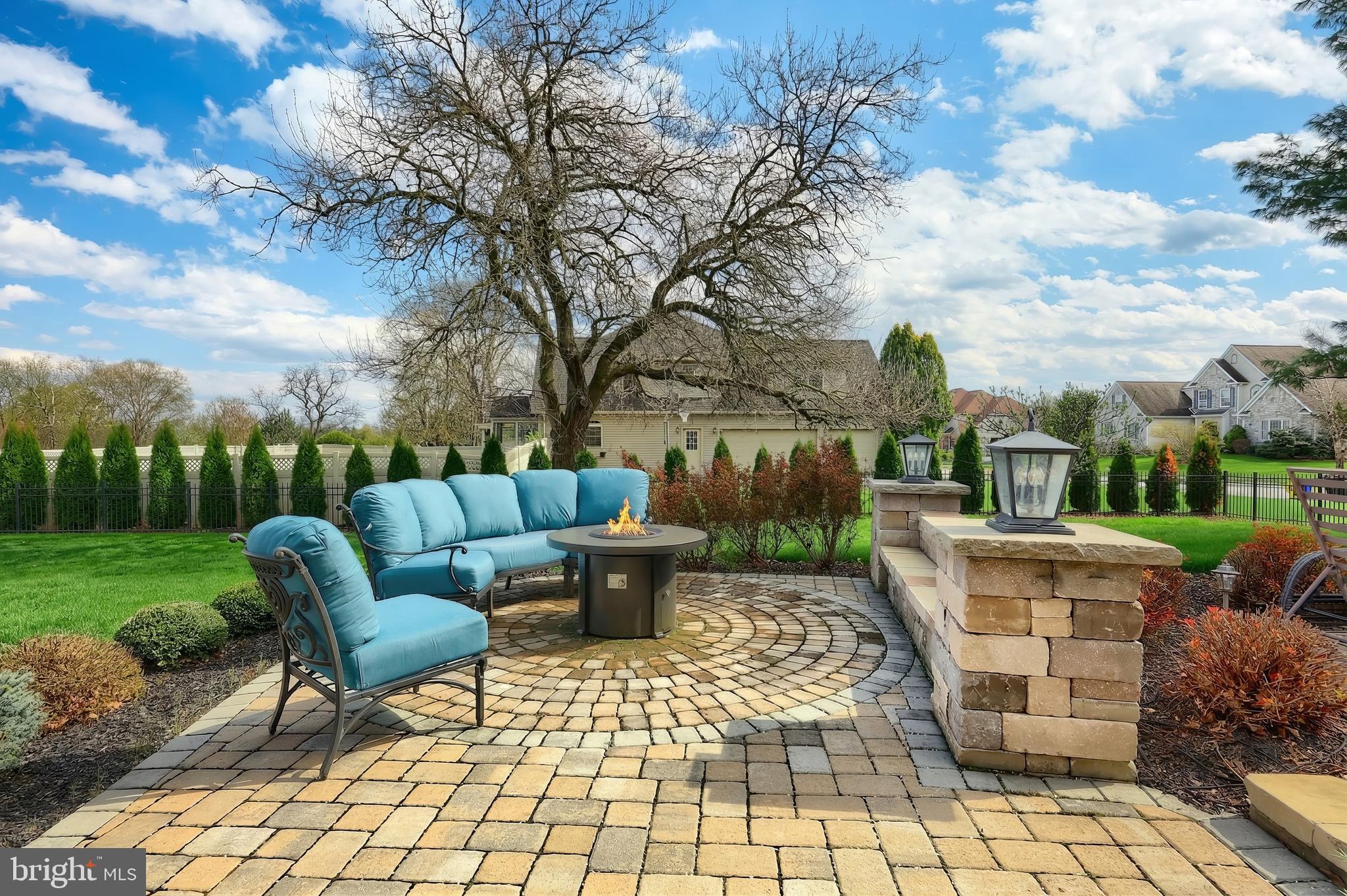 2119 Bernays Drive York, PA 17404 - Photo 16 of 72 a view of a patio with table and chairs potted plants and large tree