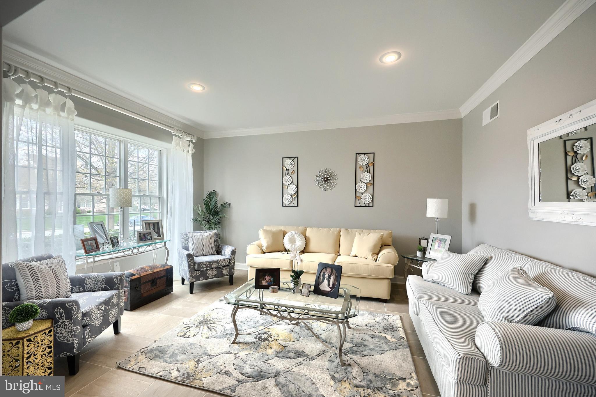 2119 Bernays Drive York, PA 17404 - Photo 23 of 72 a living room with furniture large window and a table