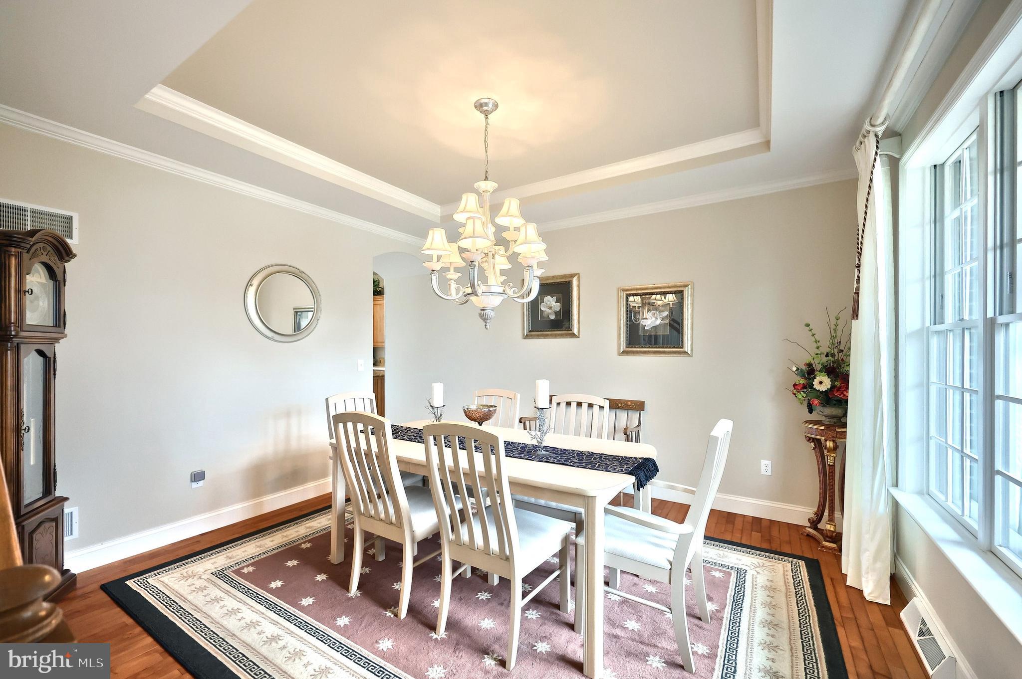 2119 Bernays Drive York, PA 17404 - Photo 24 of 72 a view of a dining room with furniture and a chandelier
