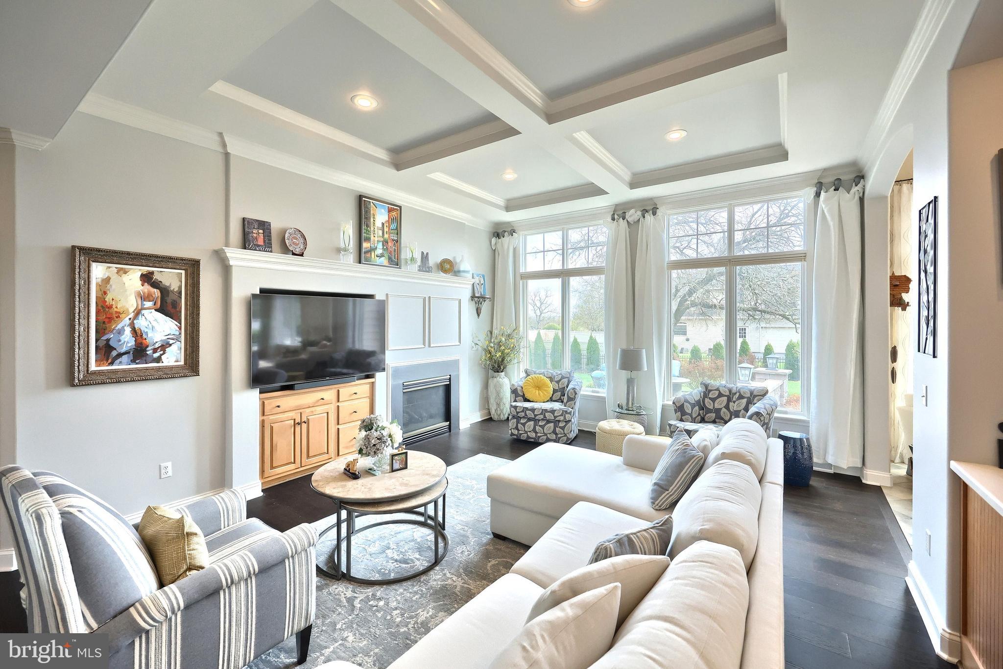 2119 Bernays Drive York, PA 17404 - Photo 28 of 72 a living room with furniture a flat screen tv and a large window