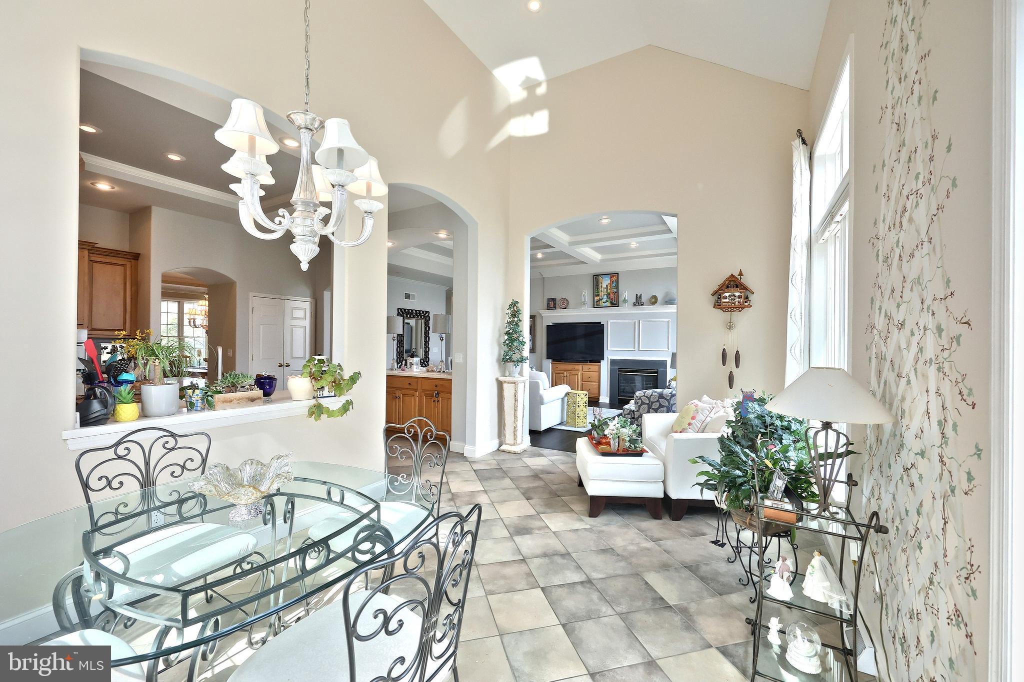 2119 Bernays Drive York, PA 17404 - Photo 31 of 72 a living room with patio bathtub and chandelier