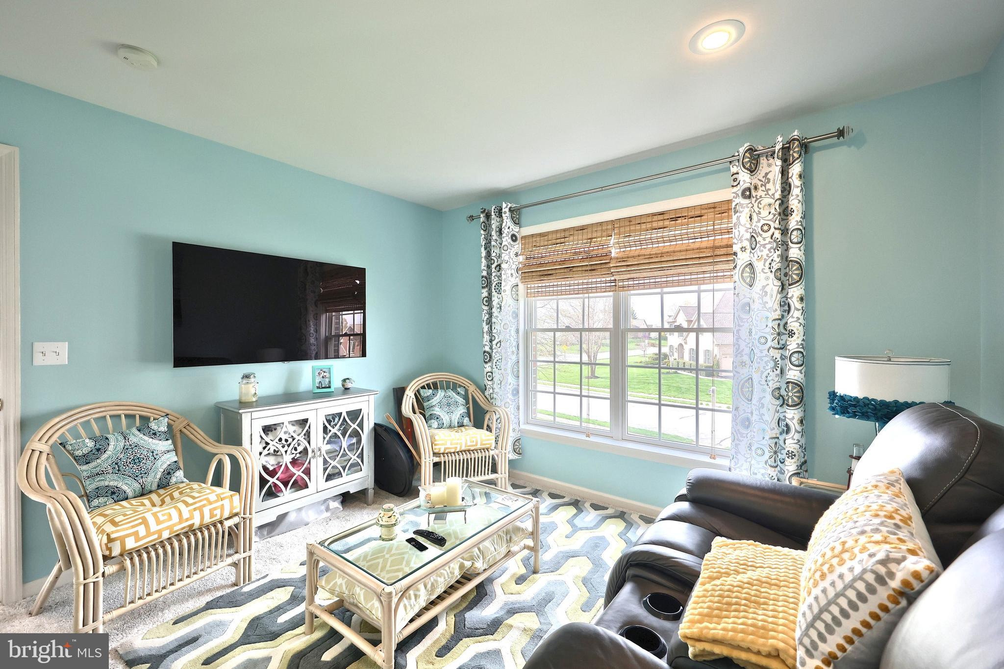 2119 Bernays Drive York, PA 17404 - Photo 46 of 72 a living room with furniture and a flat screen tv