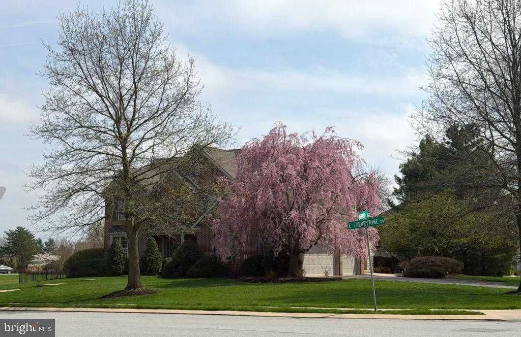 2119 Bernays Drive York, PA 17404 - Photo 66 of 72 a front view of a house with a yard and trees
