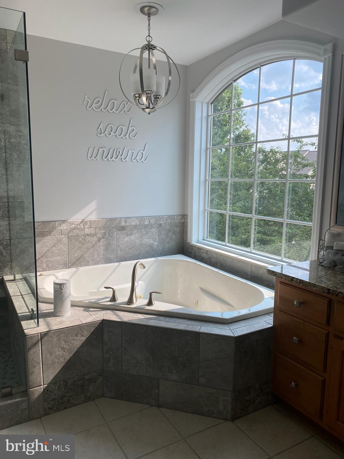 2119 Bernays Drive York, PA 17404 - Photo 71 of 72 a spacious bathroom with a sink a bathtub and next to a window