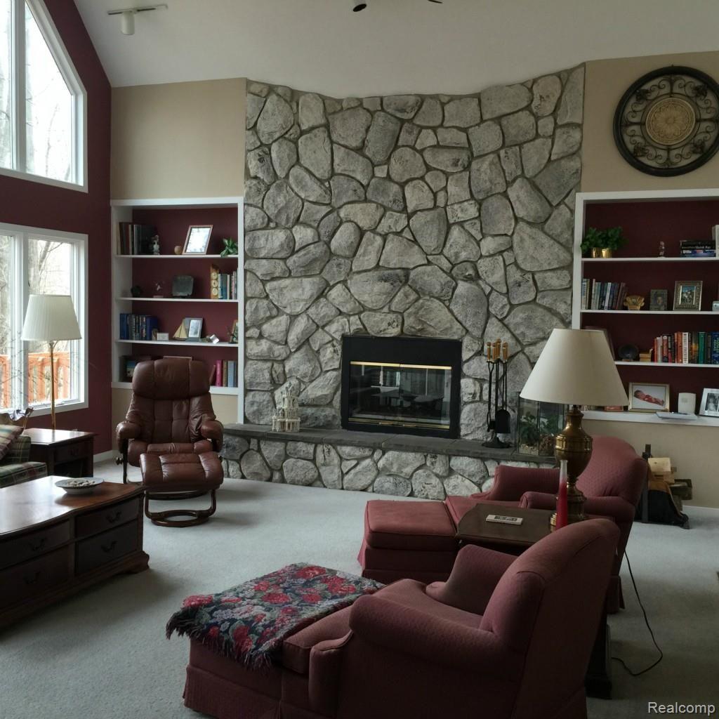 5141 Argentine Road Howell, MI 48855 - Photo 18 of 37 Wood burning fireplace and built in bookcases.