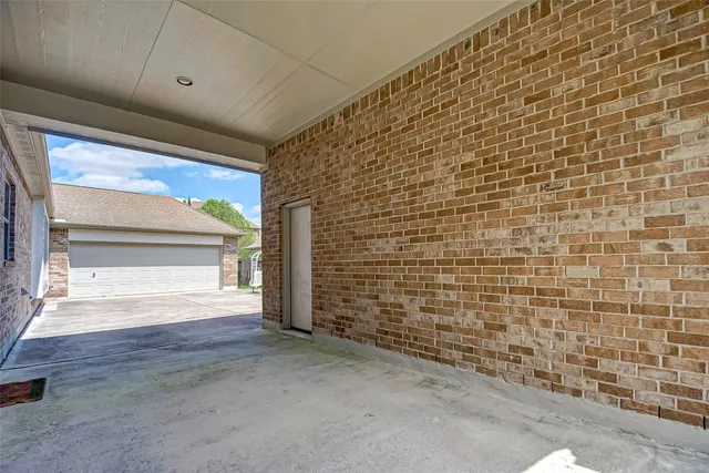 a view of an empty room and a window